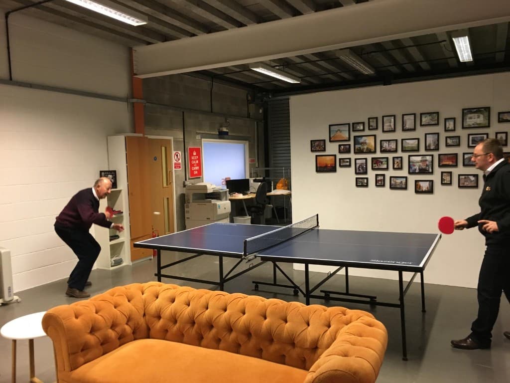 Martin playing table tennis with his father at the C2S office