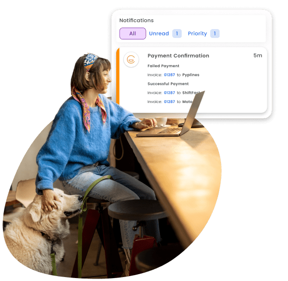 Image of a lady stroking a dog while she pays her bills