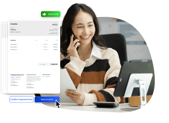Image of a person at a desk smiling as she makes easier payments 