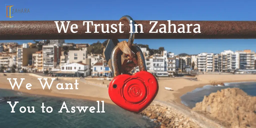 A red heart-shaped padlock attached to a rail overlooking a beach and coastal town with text reading "We Trust in Zahara. We Want You to Aswell," symbolizing the confidentiality and trust we place in Zahara.