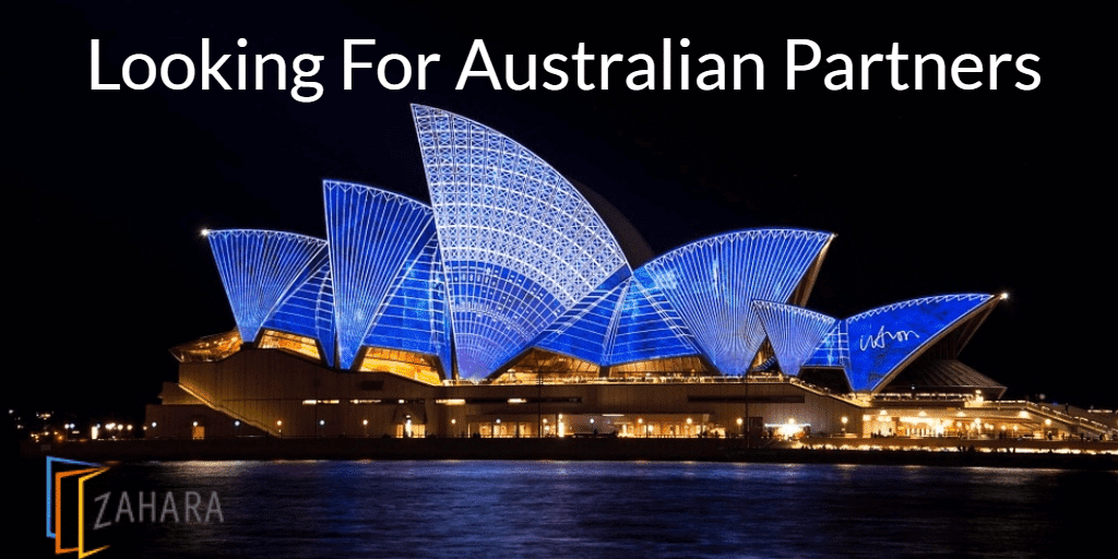 Image of the Sydney Opera House illuminated at night with blue lights, featuring a "Looking For Australian Partners" headline and a "Zahara" logo in the bottom left corner. This stunning visual captures the essence of Australia and its vibrant opportunities.