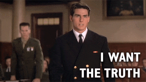 A person in a military uniform stands assertively in a courtroom, with the text "I WANT THE TRUTH" displayed.